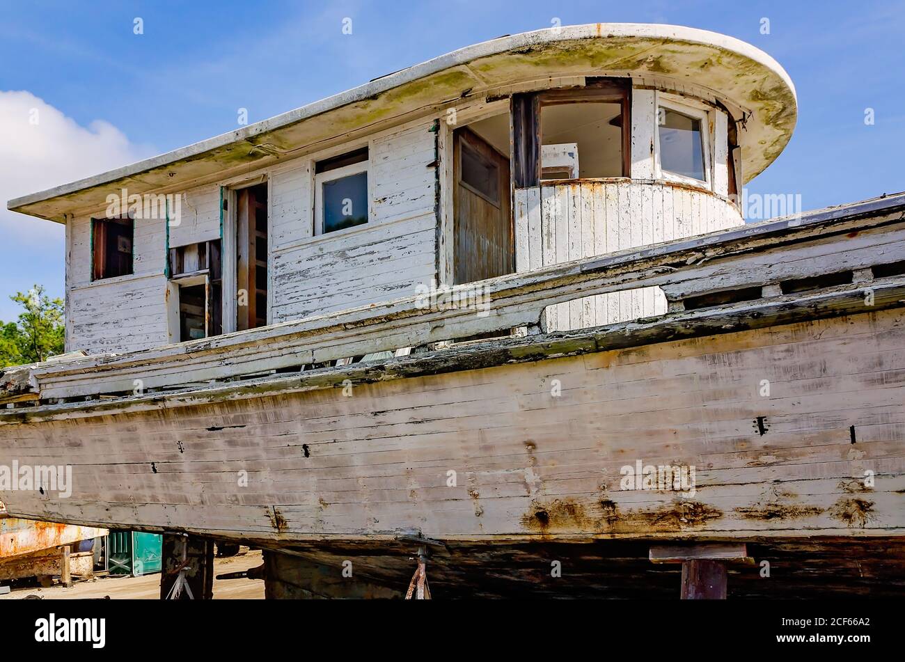 An old wooden shrimp boat sits in dry dock for repair at a local shipyard, Feb. 17, 2018, in Bayou La Batre, Alabama. Stock Photo