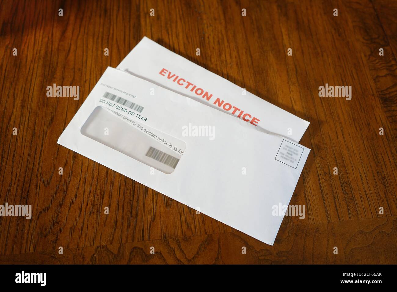Close-up Of An Eviction Notice In Envelope on Desk Stock Photo