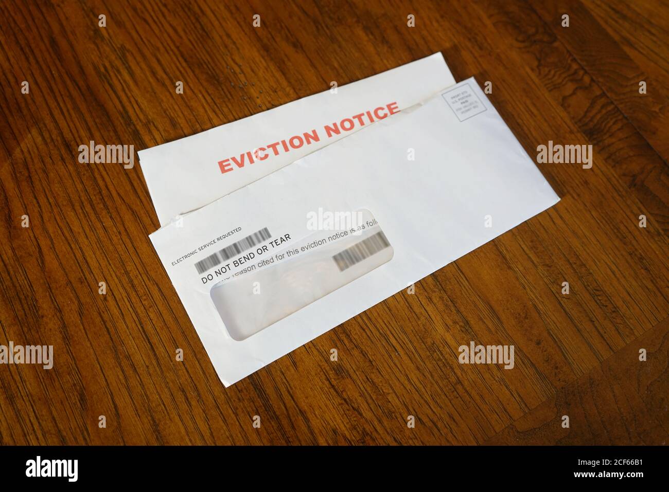 Close-up Of An Eviction Notice In Envelope on Desk Stock Photo