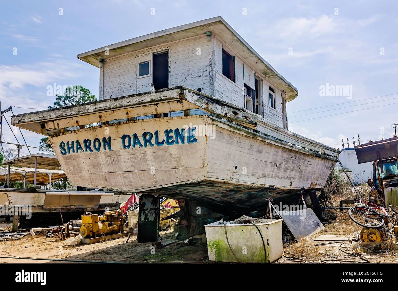 An old wooden shrimp boat sits in dry dock for repair at a local shipyard, Feb. 17, 2018, in Bayou La Batre, Alabama. Stock Photo