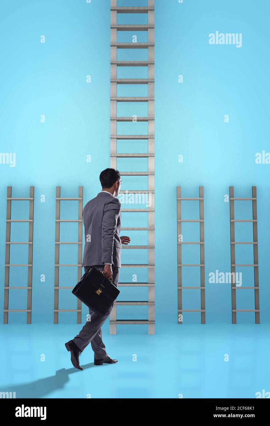 The businessman climbing career ladder in business success concept ...