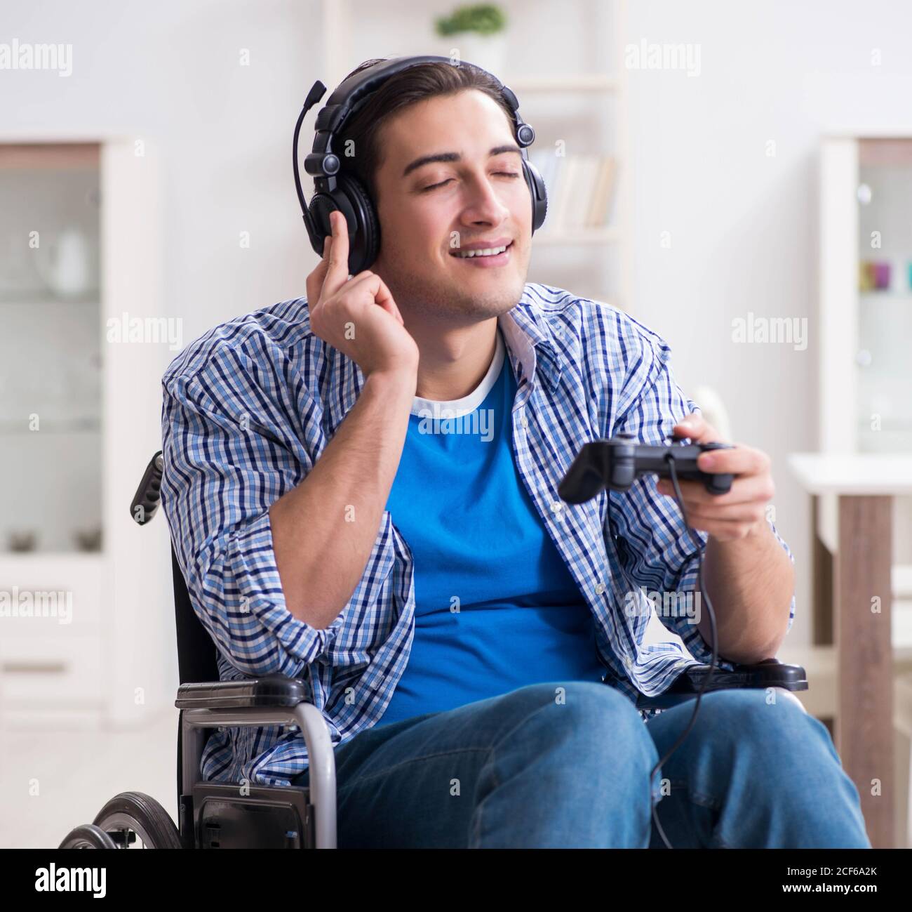 The disabled man playing computer games during rehabilitation Stock