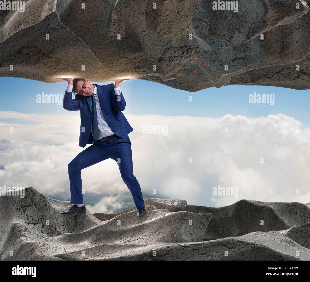 Businessman supporting stone under pressure hi-res stock photography ...