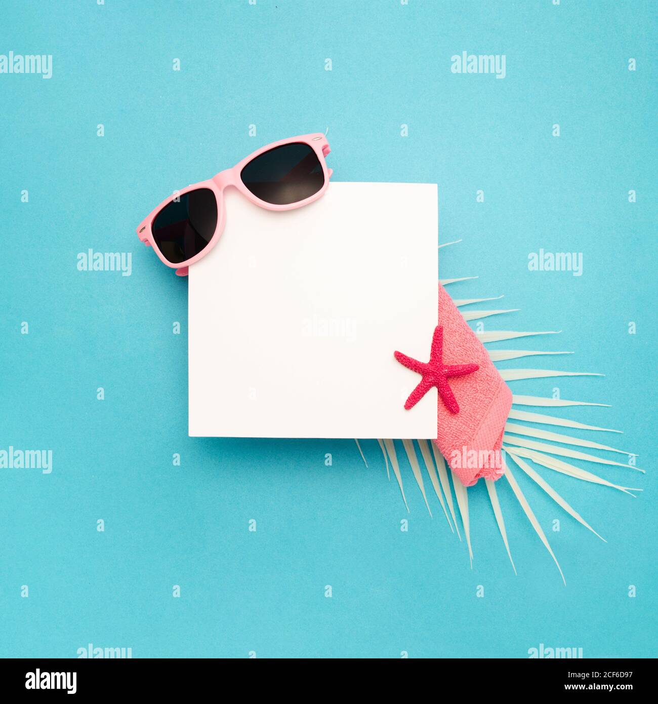 Top view composition with sunglasses and colorful starfish arranged ...