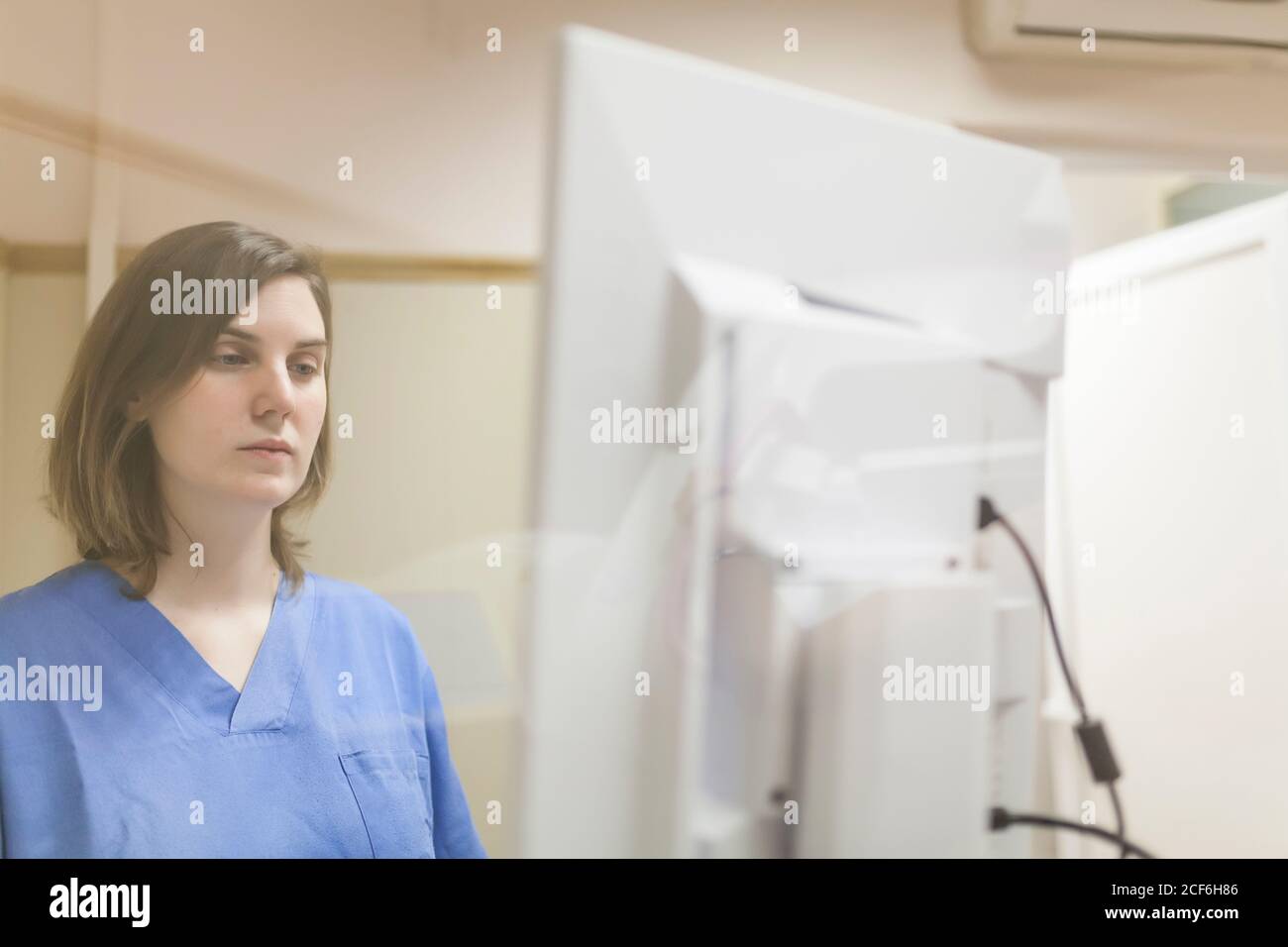 Female doctor using digital equipment for mammography Stock Photo
