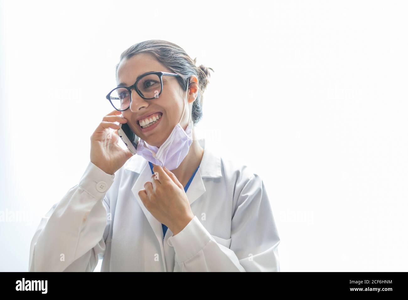 female dentist talking on the phone Stock Photo