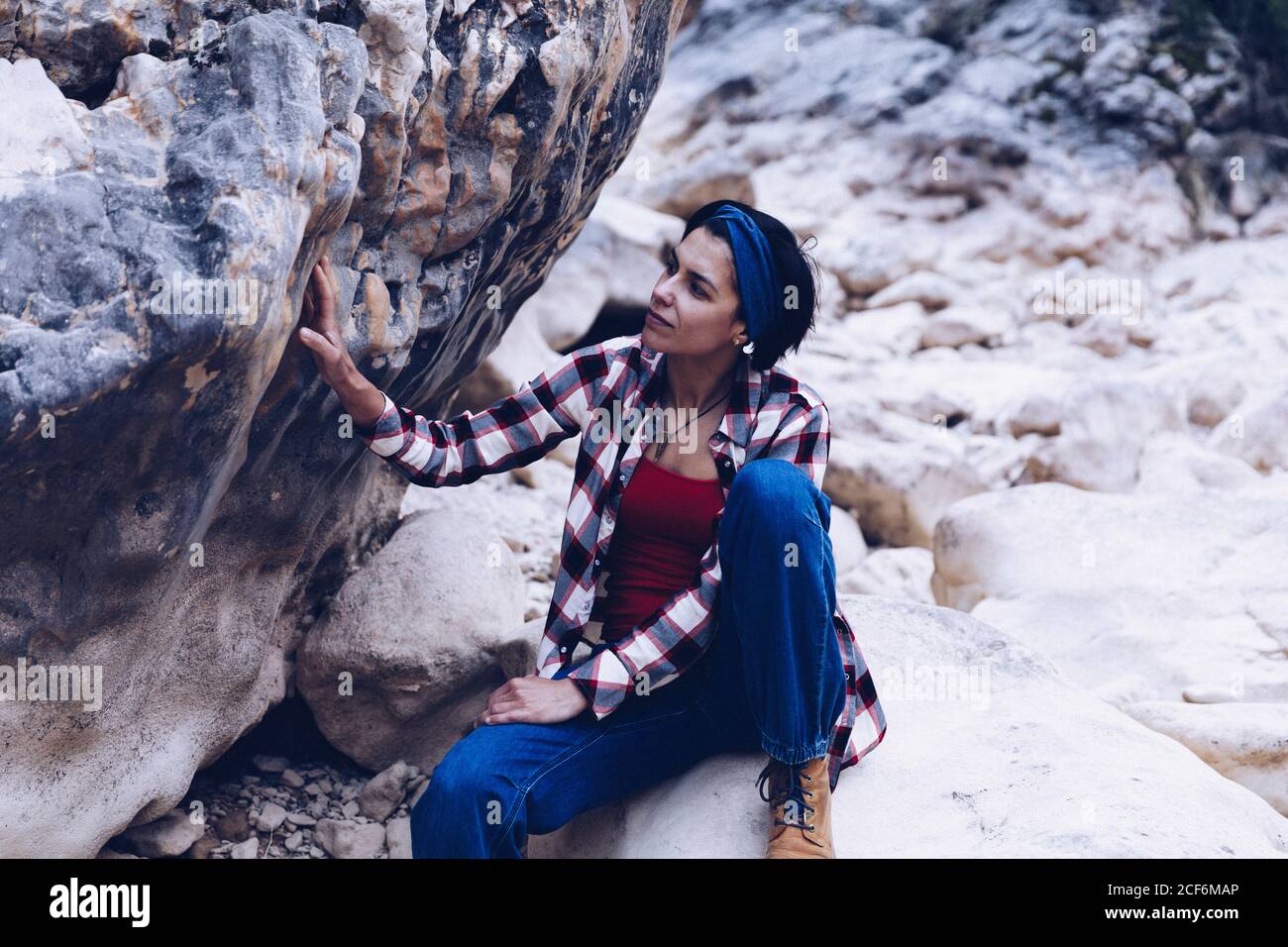 Woman resting on rock hi-res stock photography and images - Alamy