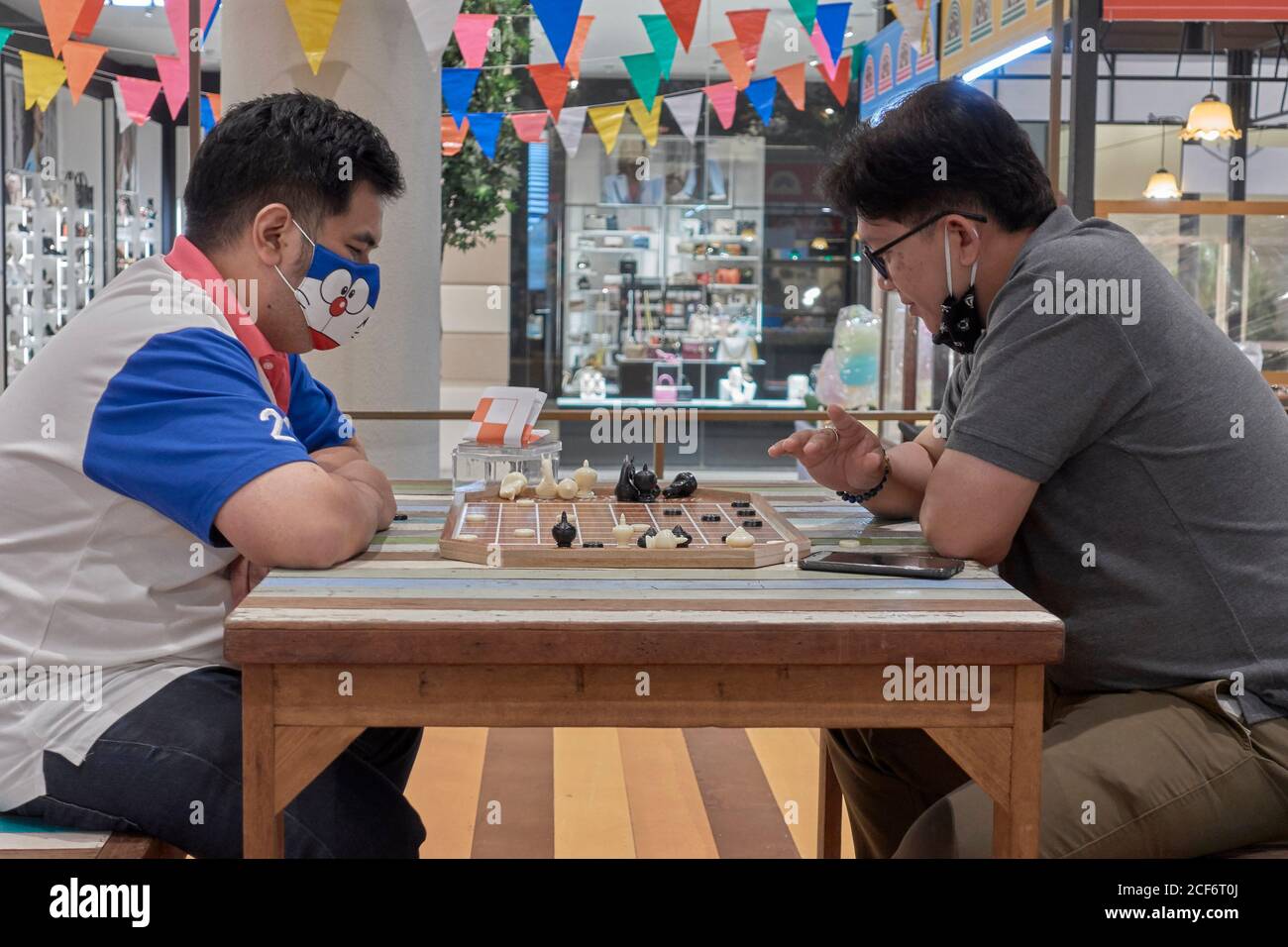 Thailand chess. Men playing Makruk, which is a Thailand version of chess. Southeast Asia Stock Photo