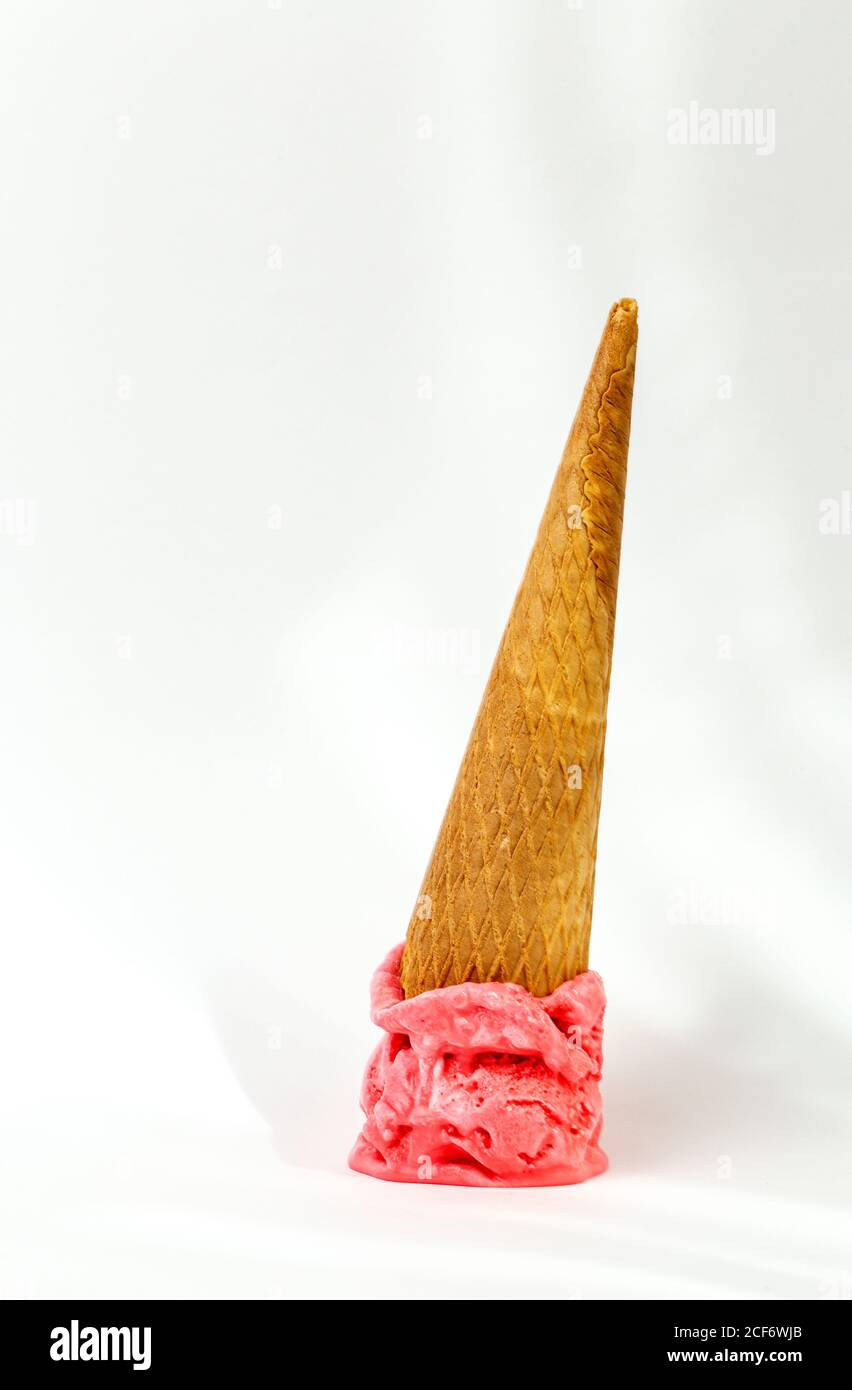 Dropped melting ice cream cone Stock Photo
