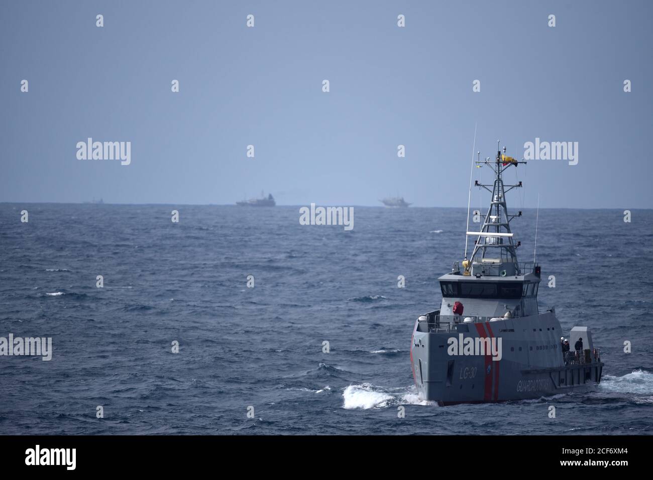 The Ecuadorian naval vessel LAE Isla San Cristobal (LG 30) sails toward the Coast Guard Cutter Bertholf (WMSL 750) while conducting a joint patrol to detect and deter potential Illegal, Unreported, and Unregulated (IUU) fishing in the vicinity of the Galapagos Islands, Aug. 28, 2020. From Aug. 25-29, Bertholf patrolled over 3,000 square nautical miles of Ecuadorian and international waters and conducted joint operations with the LAE Isla San Cristobal, providing persistent presence and surveillance of fishing activity throughout the region. U.S. Coast Guard photo. Stock Photo