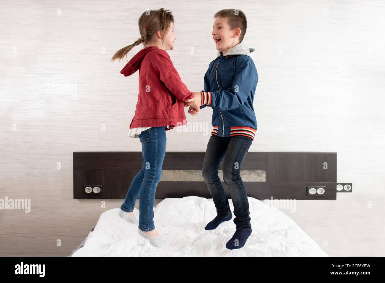 Boy and girl holding hands hi-res stock photography and images - Alamy
