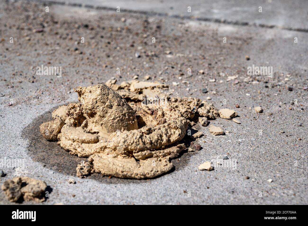 Practice of repairing uneven concrete slabs by drilling holes and