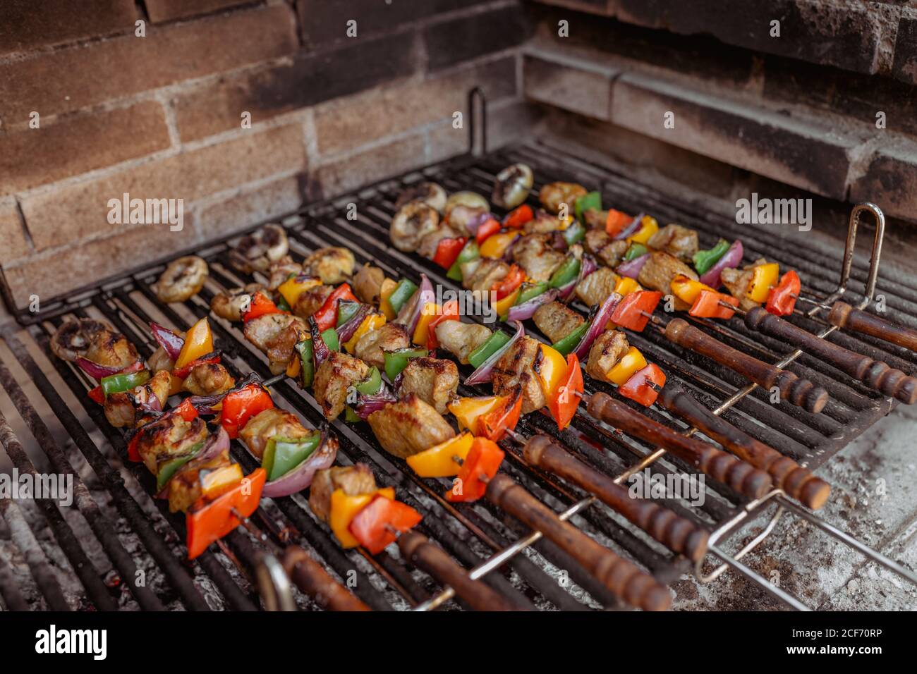cooking skewers in barbecue Stock Photo Alamy