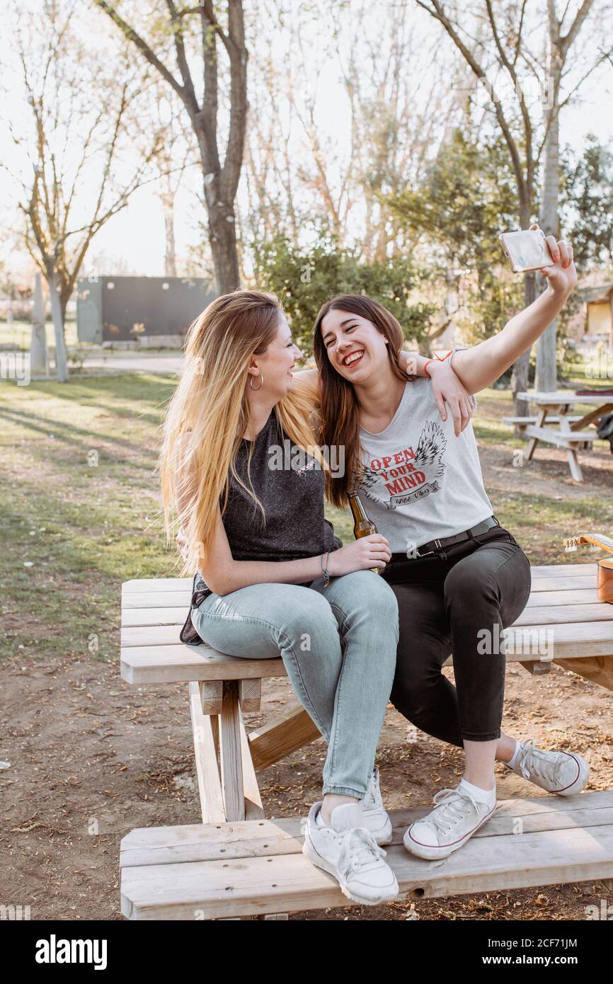 Smiling women taking selfie in park Stock Photo
