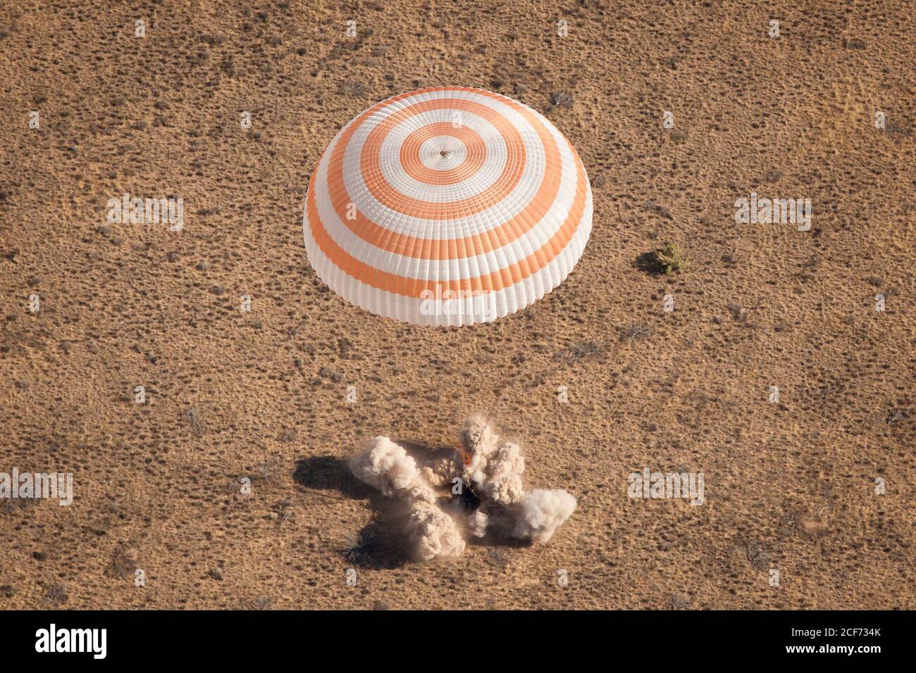 The Soyuz TMA-21 spacecraft is seen as it lands with Expedition 28 Commander Andrey Borisenko, and Flight Engineers Ron Garan, and Alexander Samokutyaev in a remote area outside of the town of Zhezkazgan, Kazakhstan, on Friday, Sept. 16, 2011. NASA Astronaut Garan, Russian Cosmonauts Borisenko and Samokutyaev are returning from more than five months onboard the International Space Station where they served as members of the Expedition 27 and 28 crews. Photo Credit: (NASA/Bill Ingalls) Stock Photo
