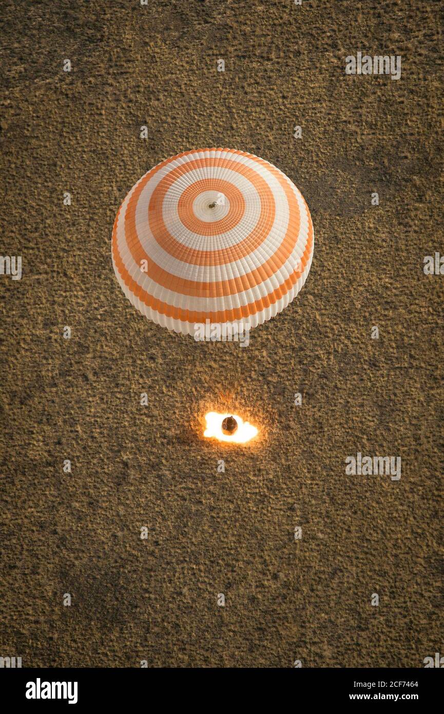 The Soyuz TMA-08M spacecraft with Expedition 36 Commander Pavel Vinogradov of the Russian Federal Space Agency (Roscosmos), Flight Engineer Alexander Misurkin of Roscosmos and Flight Engineer Chris Cassidy of NASA aboard, is seen as it lands in a remote area near the town of Zhezkazgan, Kazakhstan, on Wednesday, Sept. 11, 2013. Vinogradov, Misurkin and Cassidy returned to Earth after five and a half months on the International Space Station. Photo Credit: (NASA/Bill Ingalls) Stock Photo