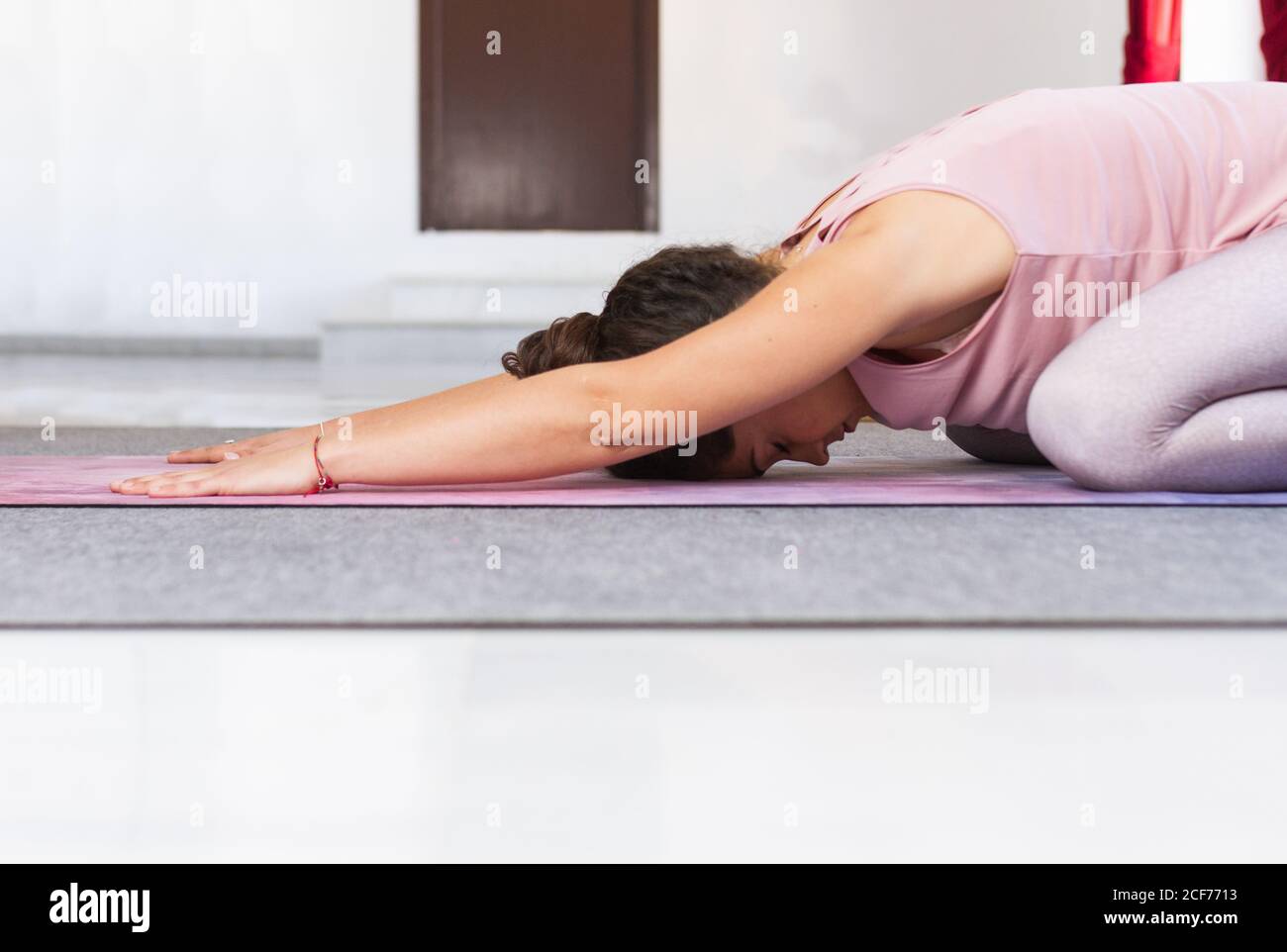 Flexible sportive brunette doing yoga pose Stock Photo