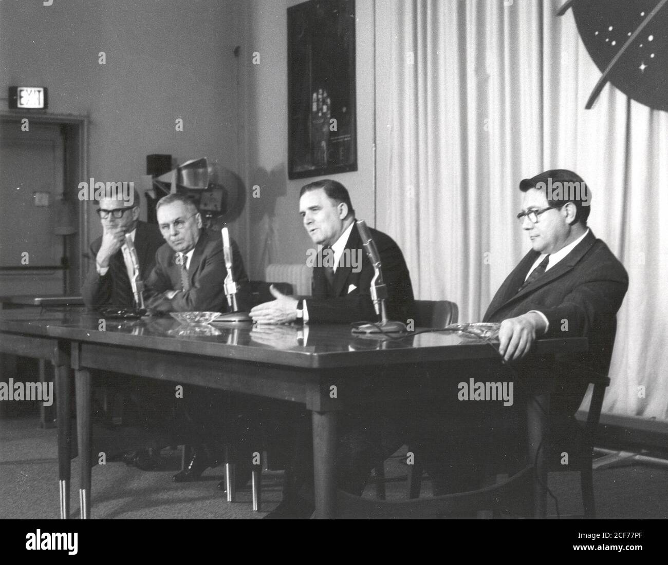 After the successful spaceflight of Yuri Gagarin, the first person to fly in space, as well as orbit Earth, NASA held a press conference at NASA Headquarters in Washington, DC to respond to questions concerning Gagarin's flight and the status of the American space program. From left to right: Dr. Robert C. Seamans Jr., Associate Administrator; Dr. Hugh L. Dryden, Deputy Administrator; Mr. James E. Webb, Administrator; and Dr. Abe Silverstein, Director of Space Flight Programs. Stock Photo