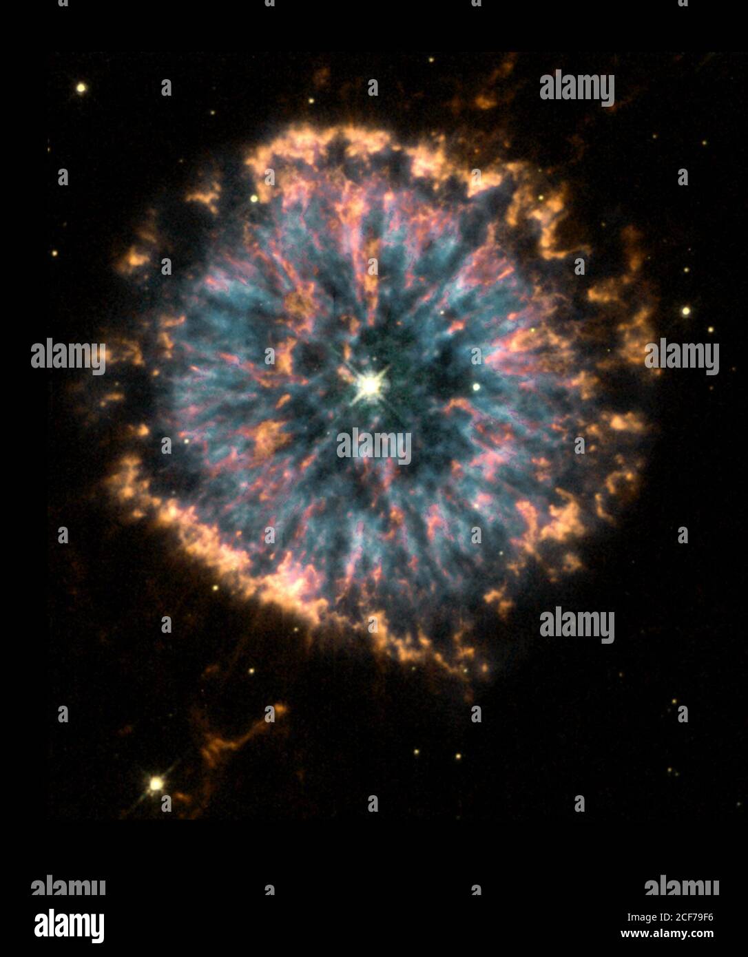 Astronomers using NASA's Hubble Space Telescope have obtained images of the strikingly unusual planetary nebula, NGC 6751. Glowing in the constellation Aquila like a giant eye, the nebula is a cloud of gas ejected several thousand years ago from the hot star visible in its center. The Hubble observations were obtained in 1998 with the Wide Field and Planetary Camera 2 (WFPC2) by a team of astronomers led by Arsen Hajian of the U.S. Naval Observatory in Washington, DC. The Hubble Heritage team, working at the Space Telescope Science Institute in Baltimore, has prepared this color rendition by c Stock Photo