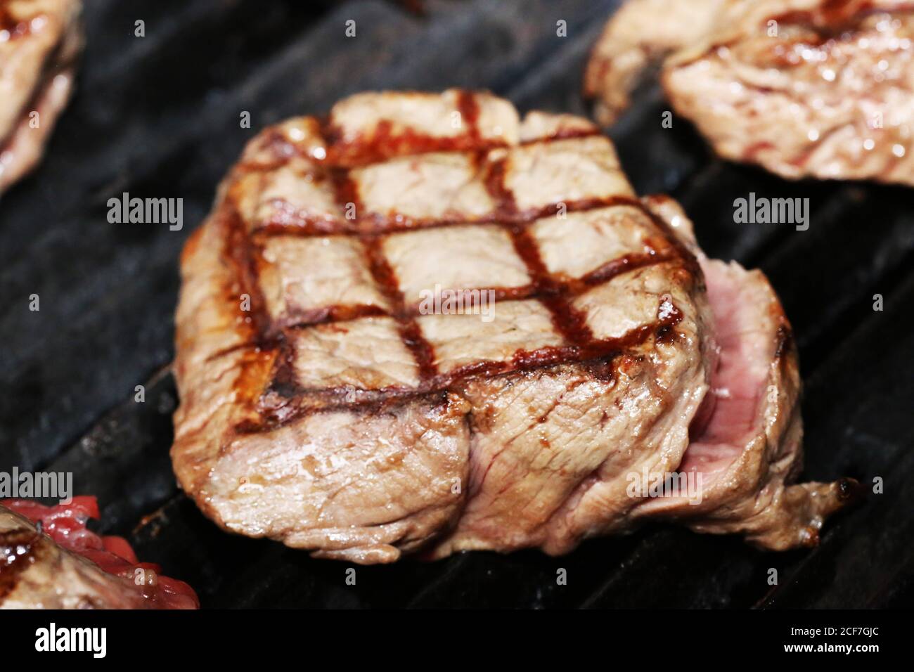 Steak on the grill with a lozenge pattern Stock Photo