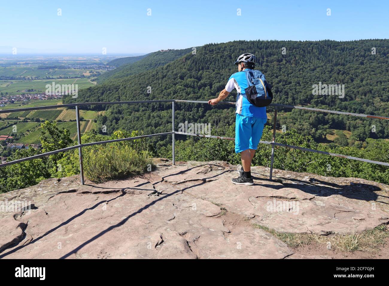 Mountain biker on the viewing platform of the Neukastel castle ruins above Leinsweiler, Palatinate Forest, Germany (Model released) Stock Photo
