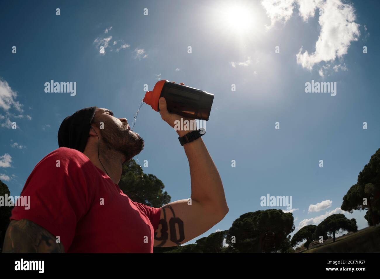 man drinking during training Stock Photo Alamy