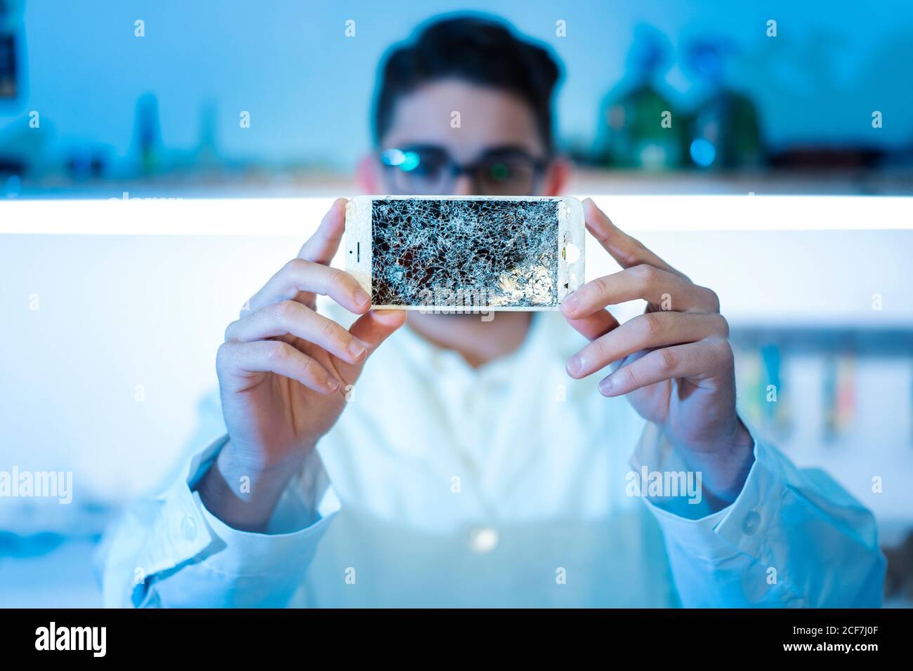 Man showing broken smartphone display Stock Photo