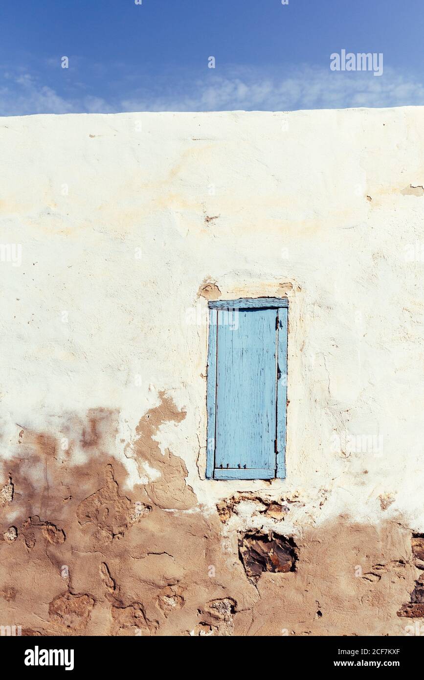 Closed window in rustic wall of old house Stock Photo - Alamy