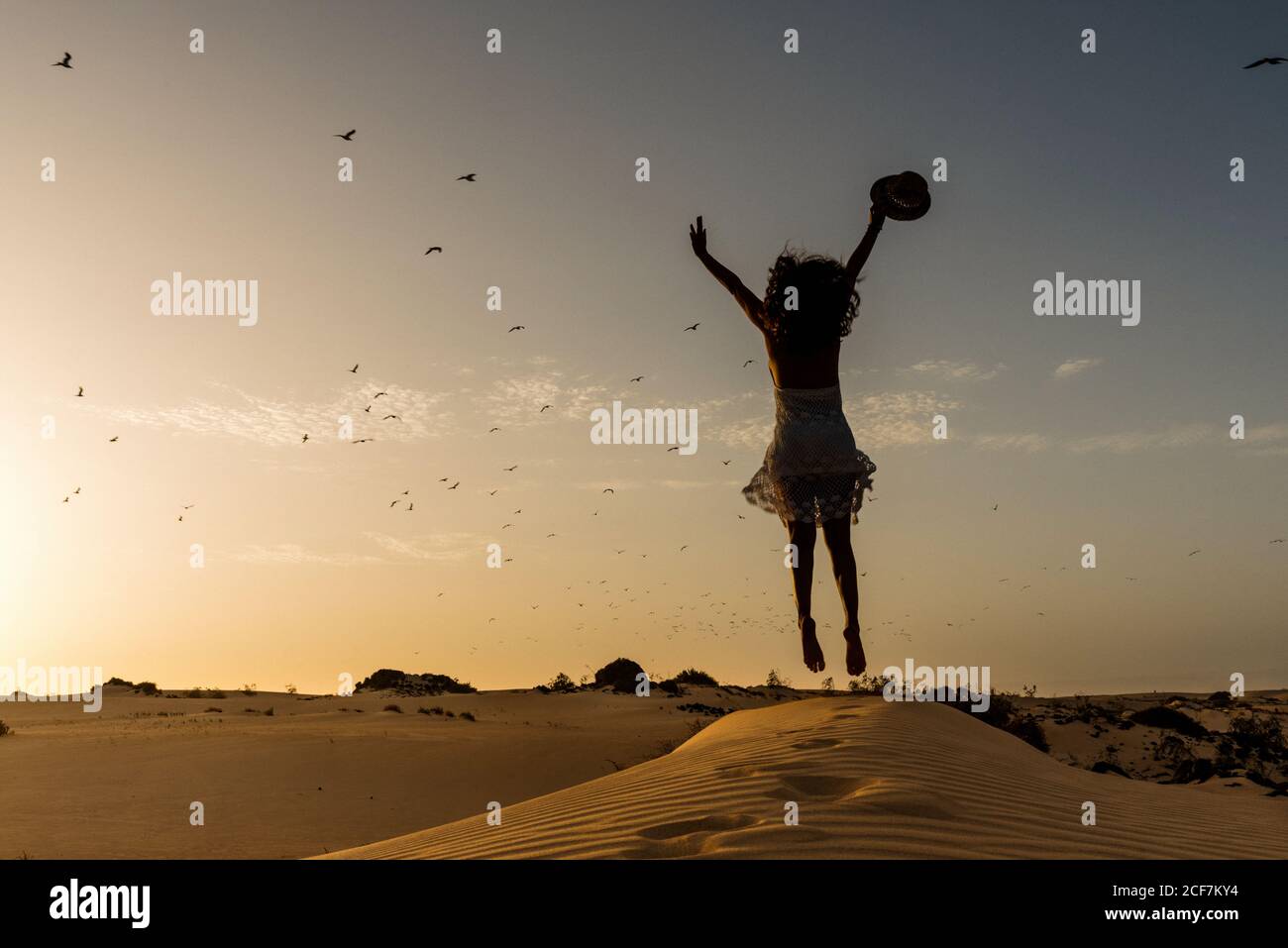 Woman jumping in desert hi-res stock photography and images - Alamy