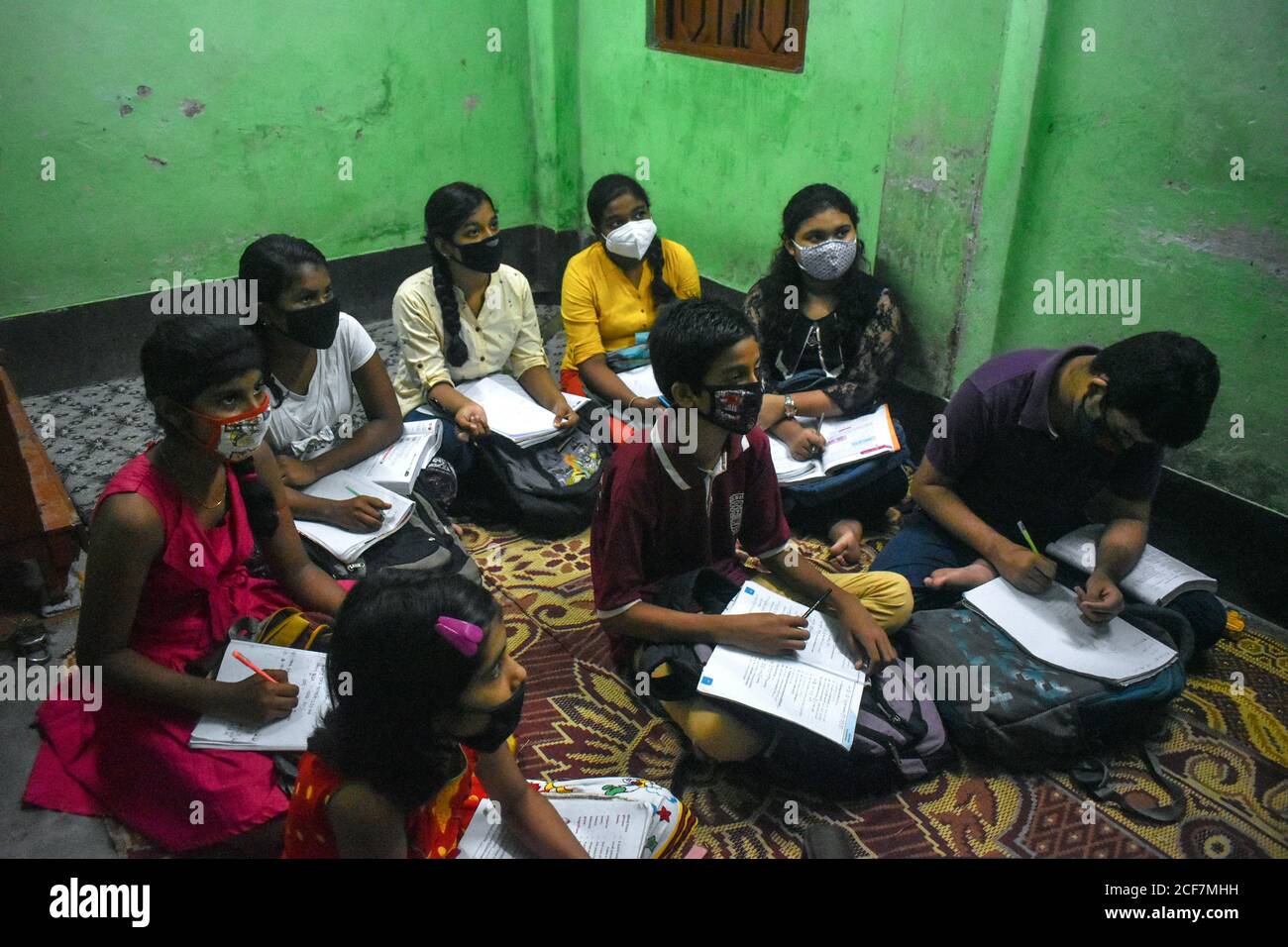 kolkata-india-03rd-sep-2020-koustav-kanjilal-a-math-teacher-taking-mathematics-class-on-his-tuition-centre-during-the-unlock-stage-40-in-kolkata-for-covid-19-pandemic-schools-are-closed-but-students-doing-online-class-taking-private-tuition-and-maintaining-all-safety-norms-photo-by-sudipta-daspacific-press-credit-pacific-press-media-production-corpalamy-live-news-2CF7MHH.jpg