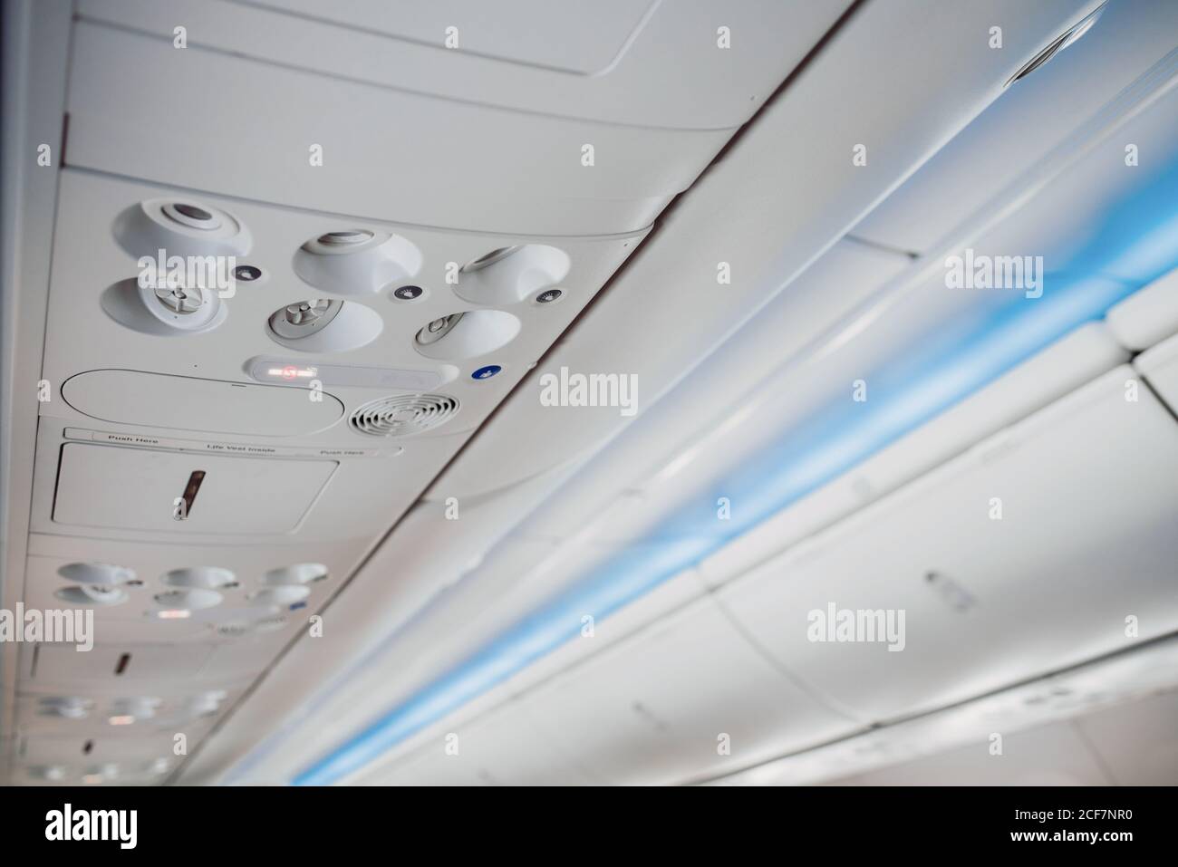 Modern elegant aircraft ceiling compartment with different buttons in