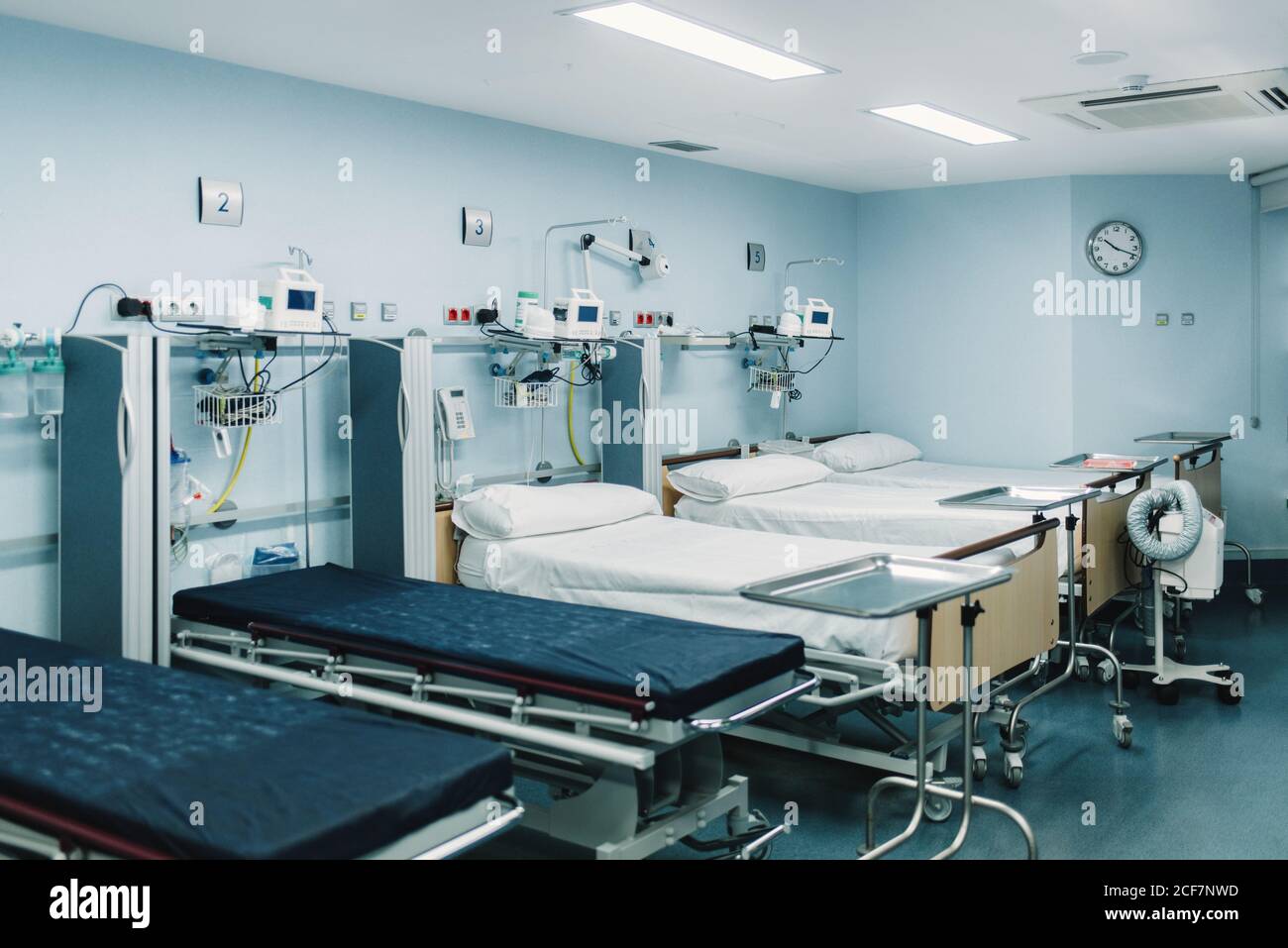 Equipped intensive care unit with beds made up for patients and metal ...