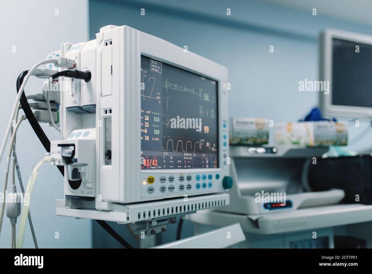Medical equipment with screens showing vital signs of patient in
