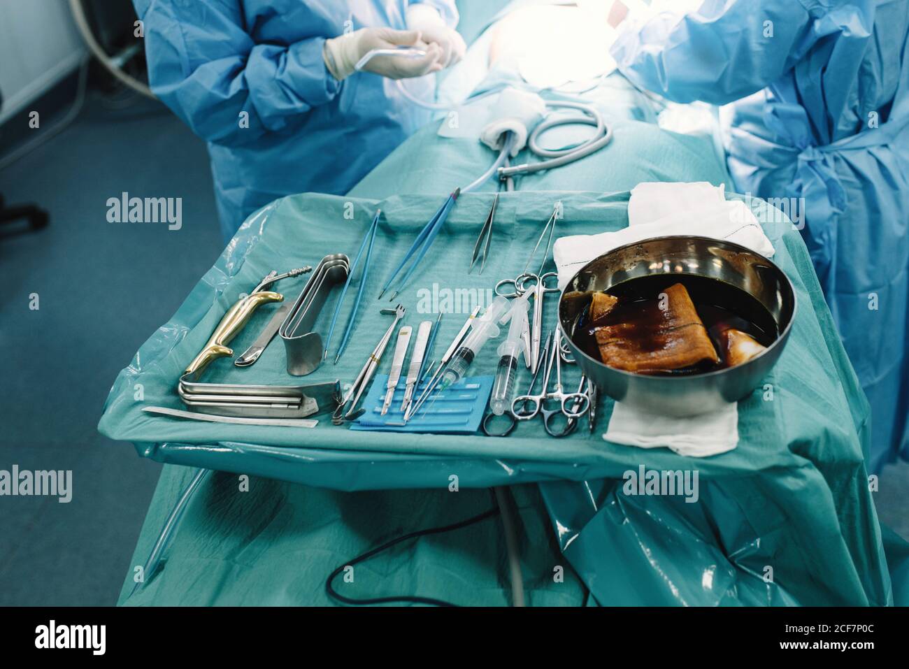 From above tray with sterile stainless tools and crop medics making ...