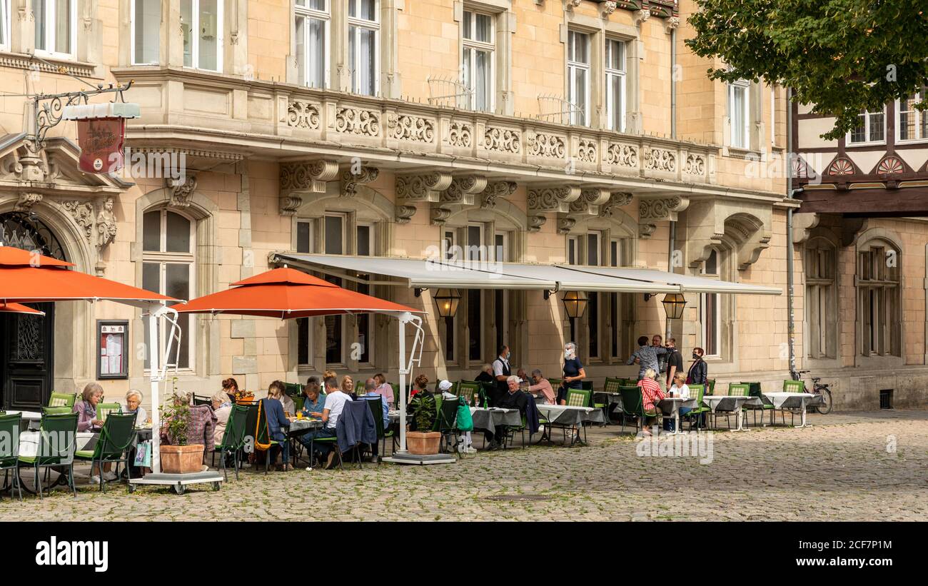 People are enjoying last warm days of summer in old town of Braunschweig. Many have shopping and eating out on agenda. Stock Photo
