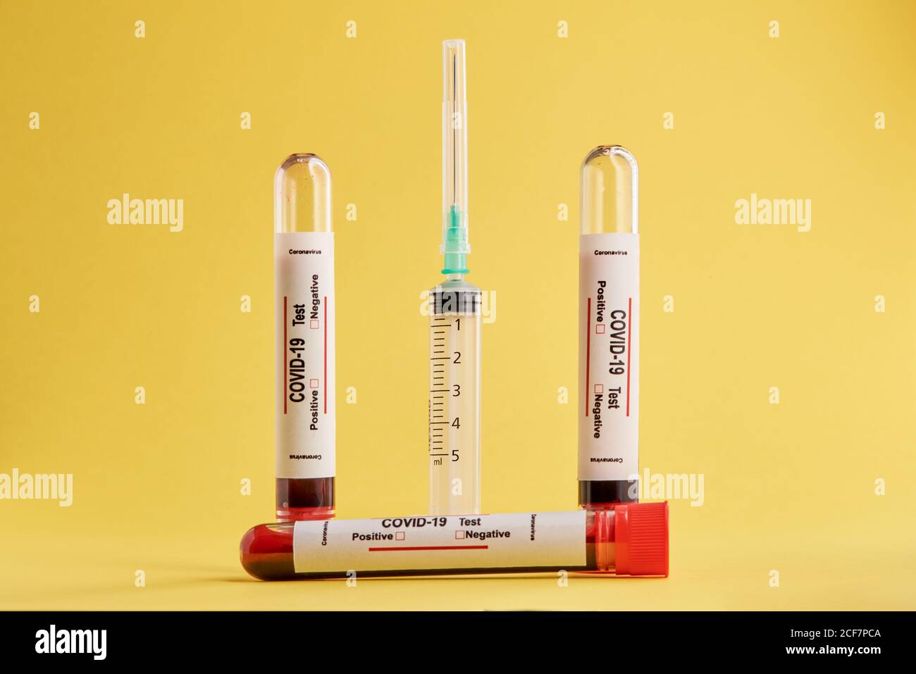 Test tubes with blood samples and syringe used for COVID 19 diagnostic