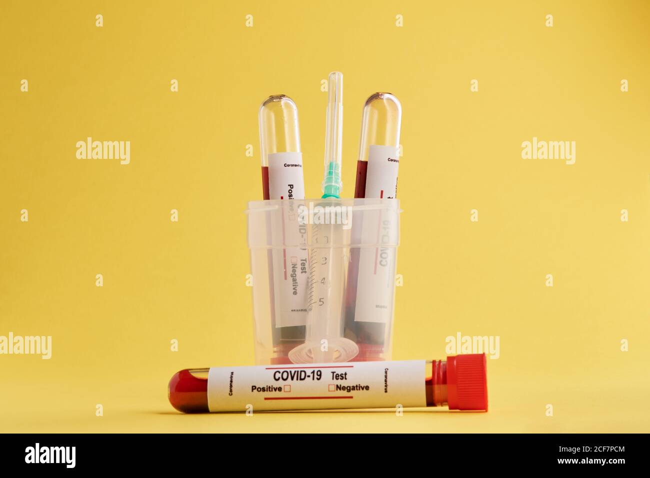 Test tubes with blood samples and syringe used for COVID 19 diagnostic