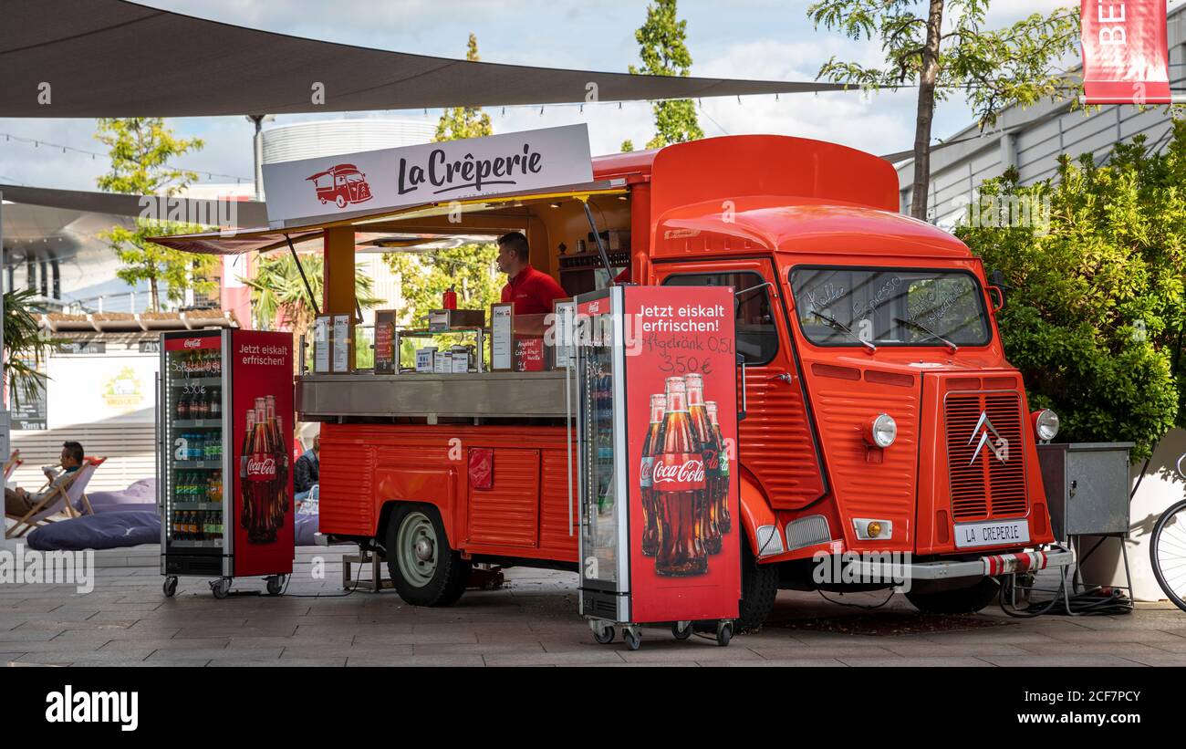 Buying crepes from special vehicles is popular all over Europe. One such car is parked permanently in Designer Outlets in Wolfsburg, Germany. Stock Photo