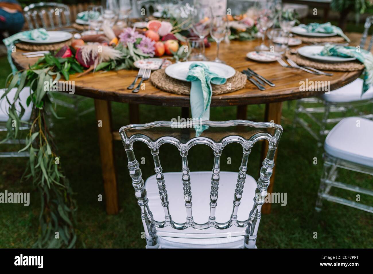 Wedding table decoration in rustic style placed outdoors Stock Photo