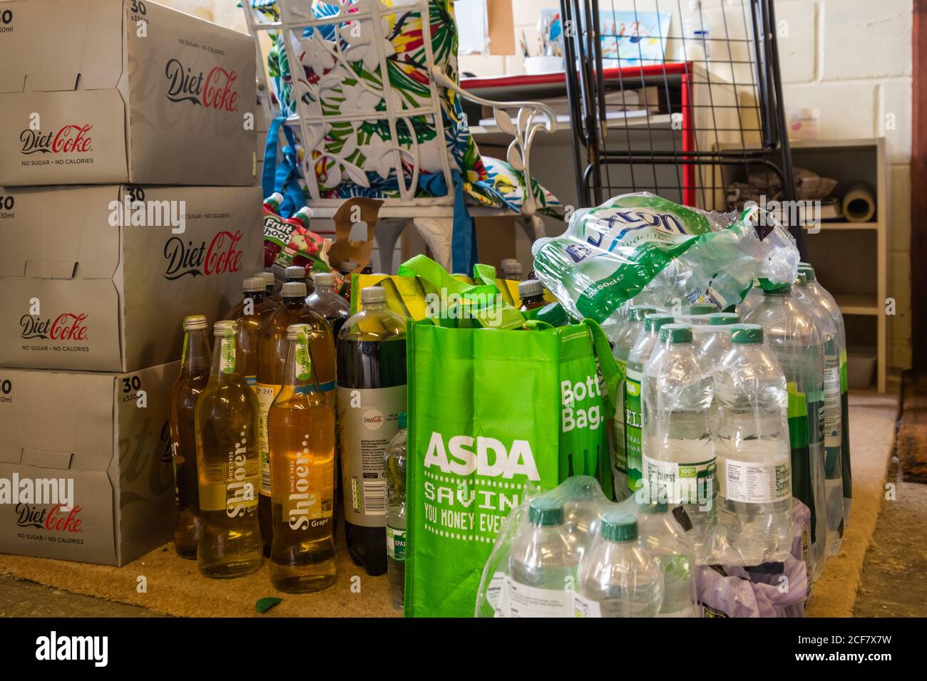 Hoard of lots of water and soft drinks stored in a garage Stock Photo Alamy