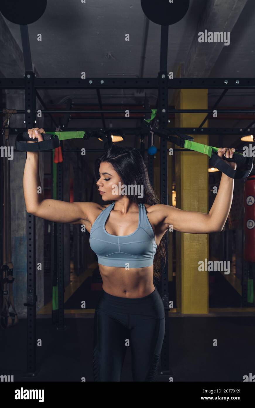 Woman pulling ropes and working out in the gym Stock Photo Alamy