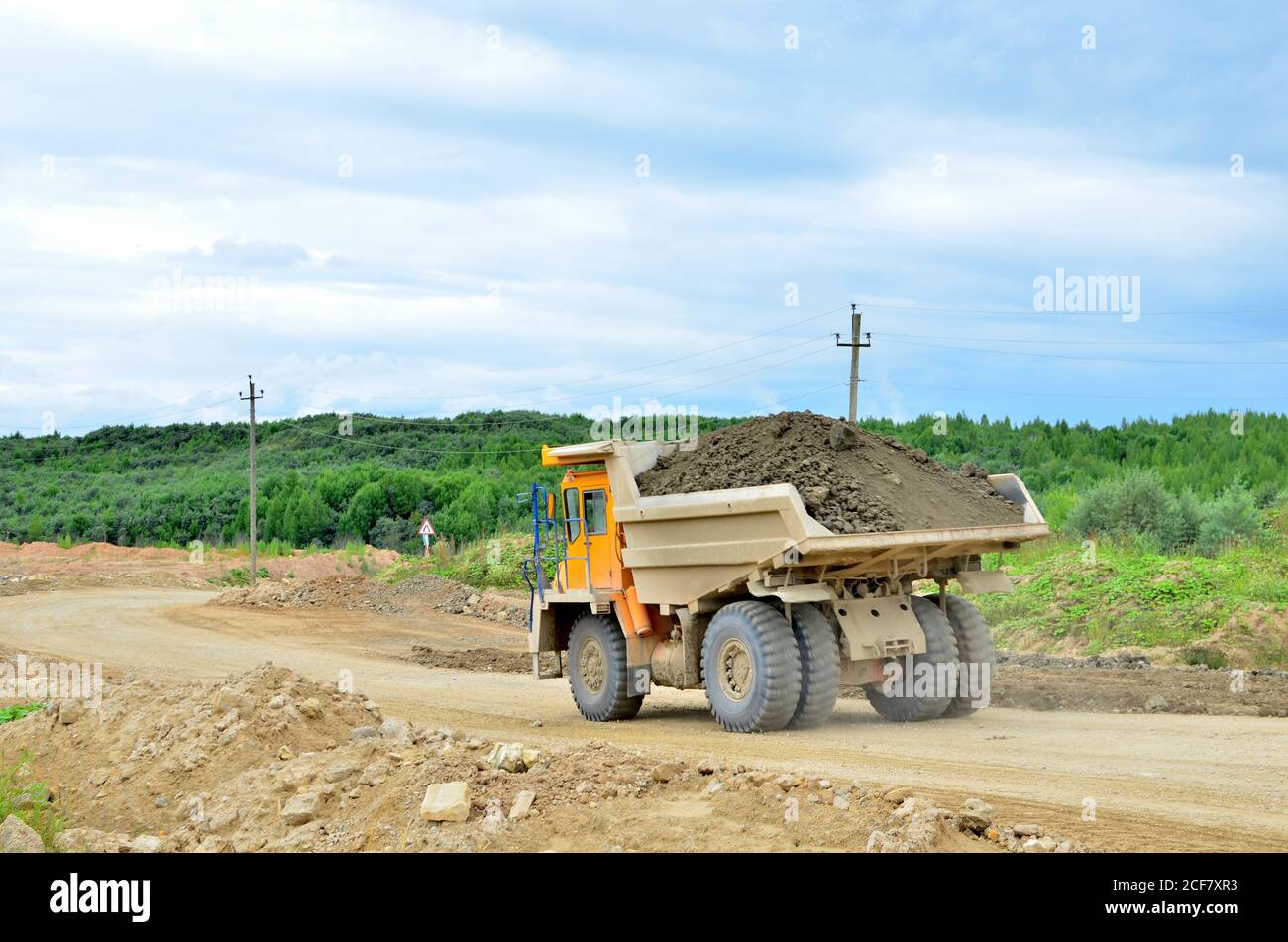 Big mining truck transport of minerals in the quarry. Opencast mining