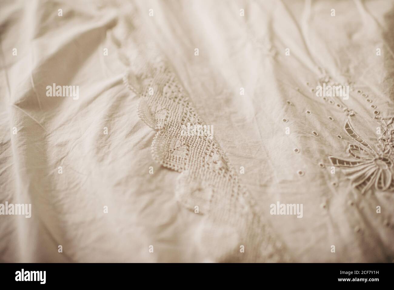 Closeup surface of vintage bed sheet decorated with elegant ornamental