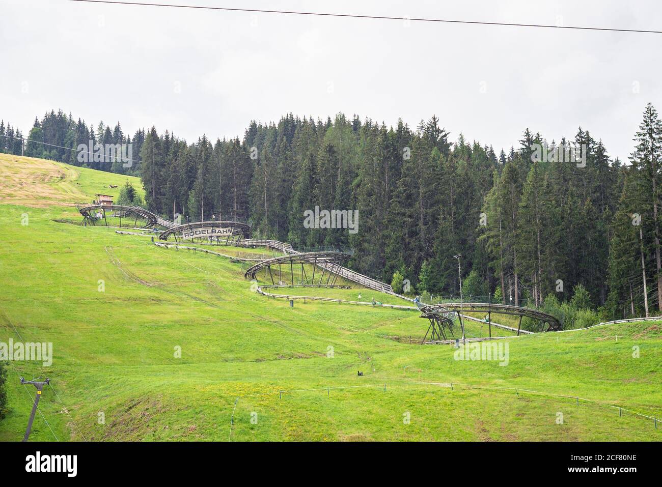 Summer toboggan run (german rodelbahn) with many curves on a mountain near the town of Flachau