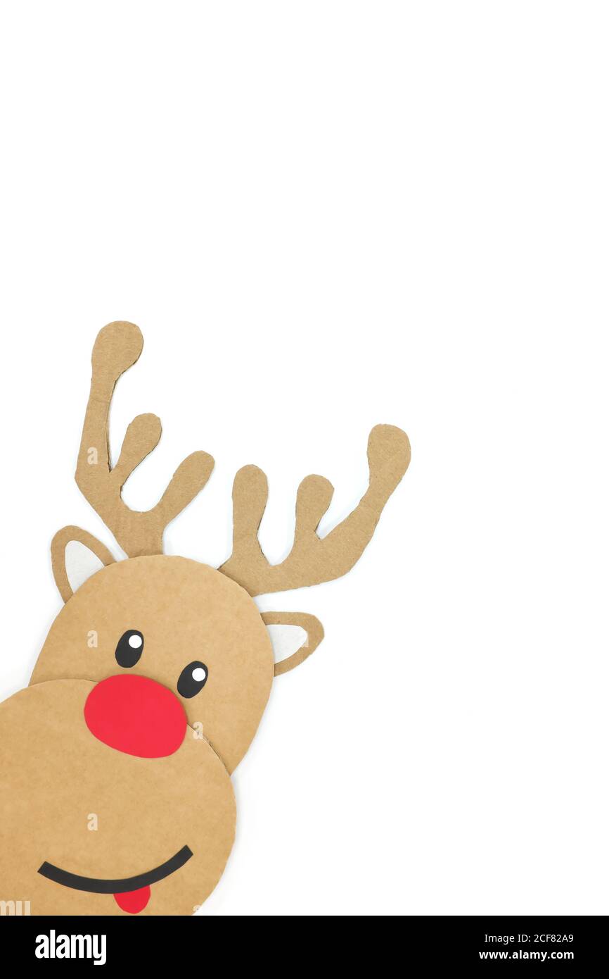 Portrait shot of cute and happy baby reindeer cardboard cutout with red