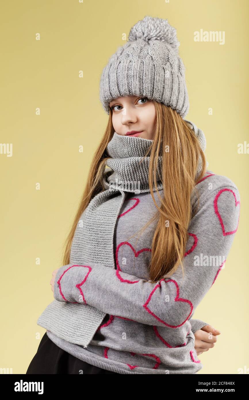 Cute teenage girl wearing gray woolen 
