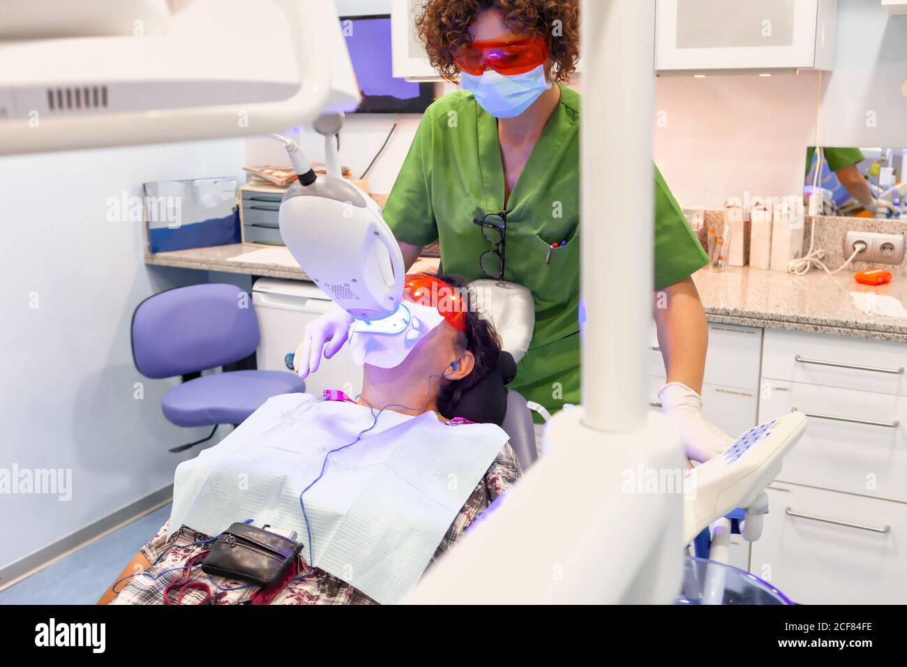 Patient lying in dental chair during x-ray procedure Stock Photo