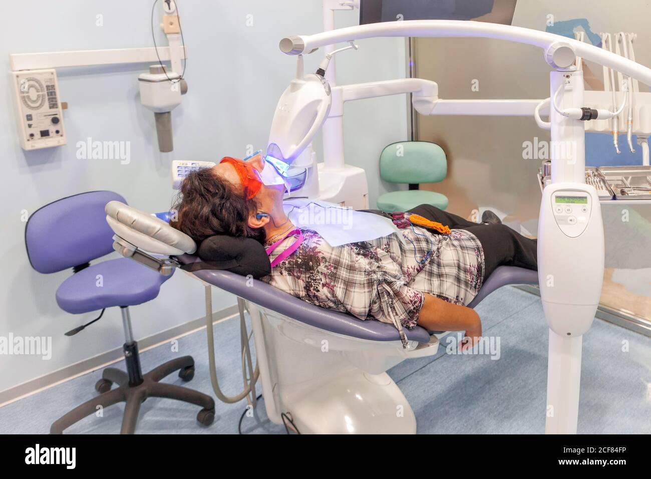 Patient lying in dental chair during x-ray procedure Stock Photo