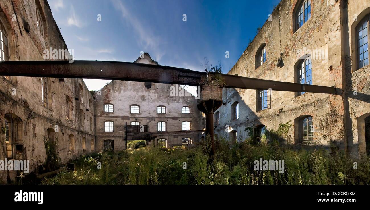 Low angle of weathered stone walls of old industrial building with ...