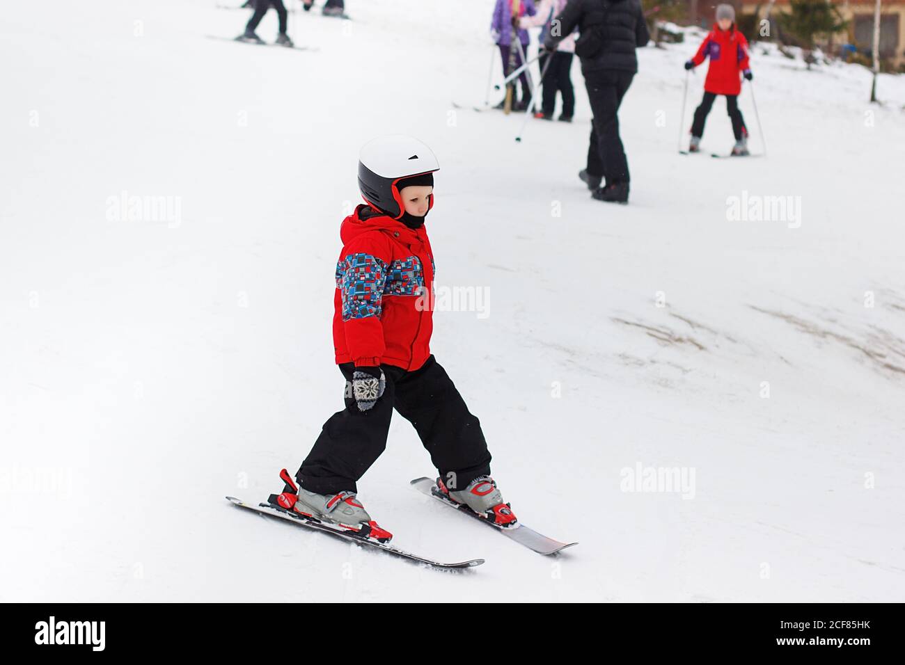 Little Cute Boy With Skis And A Ski Outfit Little Skier In The Ski Resort Winter Holidays Skiing Stock Photo Alamy Little Cute Boy With Skis And A Ski Outfit Little Skier In The Ski Resort Winter Holidays Skiing Stock Photo Alamy